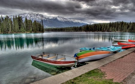 Peaceful Place - calm, summer, snow, crystal, mountain, nice, mirrored, beauty, colors, stones, pier, lakeshore, river, boats, nature, green, clear, boat, splendor, landscape, island, grass, reflection, shore, riverbank, view, lake, sky, clouds, trees, water, beautiful, lovely, colorful, mountains, peaceful