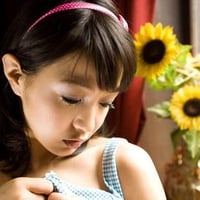 girl and sunflowers