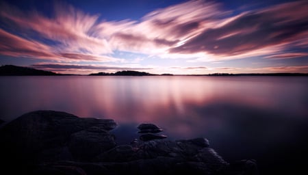 Purple Sunset - beauty, sky, trees, peaceful, water, sunset, mirrored, rocks, mauve, amazing, view, purple, reflection, clouds, hdr, lake, mountain, lovely, nature, beautiful, splendor