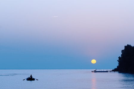 Calm Sunrise - still, water, yellow, blue, boat, morning, peaceful, sun, sky