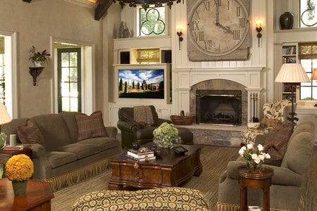 The great room - coffee table, window, chairs, couch, clock, furniture, lamp, flowers, door, sconces, fireplace, soft, tv