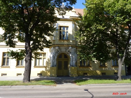 building - building, air, sun, water, tree, road