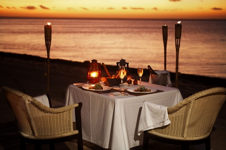 Romantic - beach, glasses, candles, chairs, wine, fire, flame, lanterns, bucket, romance, food, bread, sand, dinner, torches, ocean, toast, wicker, tablecloth, romantic, lamps, wineglasses, sea