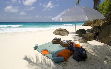 Beach picnic - nice, beach, picnic, pillows, bag, basket, rocks, waves, shade, umbrella, bottles, food, sand, drinks, towells