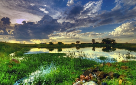 Beautiful - beauty, sky, trees, peaceful, water, colorful, sunset, view, reflection, clouds, green, house, grass, rays, houses, lake, sunlight, landscape, lovely, nature, beautiful, splendor, stones, colors