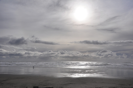 Big Beach vs. small humans - sun breaks through, wanderer, beach, sky