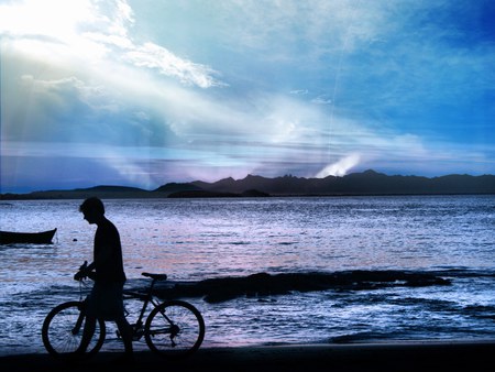 with his Cycle........... - lonely, water, beach, evening, alone, scene, sea, dark, cycle, boy, wandering, digital, hd, aurora sky