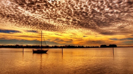 Golden Sunset - boat, reflection, sailboats, golden sunset, sailing, view, golden, sky, clouds, sunlight, trees, beautiful, sea, beauty, colors, lovely, ocean, boats, nature, sunset, sailboat, peaceful