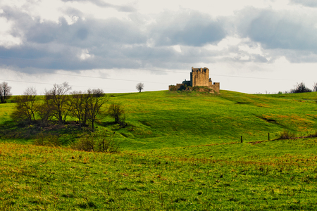 Castle in a Field - stone, sky, trees, day, light, field, in, bright, a, clouds, castle, blue, green, grass