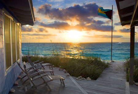 A Calypso Sunrise - house, chairs, sunrise, calypso, flag