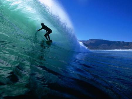 Surfing-the-tube-at-Dunes-Noordhoek-Beach-Cape-Town - water, blue, beach, surfing, ocean, marine, man, sport, board, sky