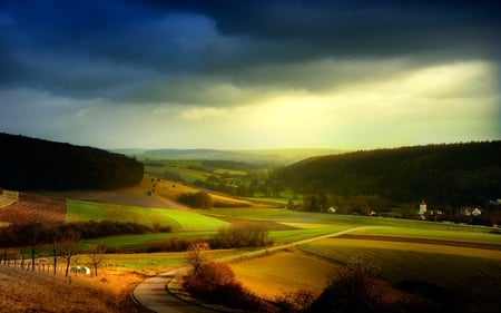 NATURE'S CARPET PIECES - pieces of carpet, hills, land, overcast, mountain the field, dark sky, buildings, sky