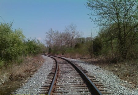 Around the bend - tracks, field, gravel, trees