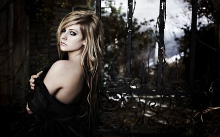 Avril Lavigne - canadian, avril lavigne, female, young girl, people, music, singer, long blond hair, dark, black dress, actresses, black sexy dress, blue eyes, songwriter, entertainment, beautiful, canada, pop singer, celebrity, dress