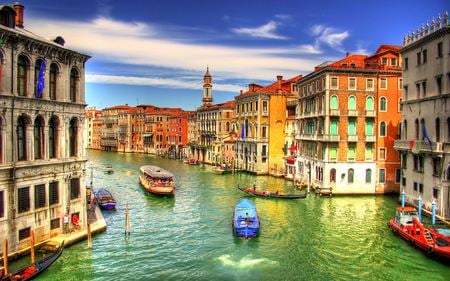 Venice - sunny, romantic, boat, italia, romance, view, venice, houses, sky, flag, clouds, house, water, beautiful, sea, city, beauty, colors, gondola, lovely, architecture, buildings, boats, colorful, nature, gondolas, flags, italy, peaceful, building