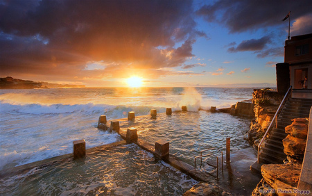 Beautiful sunrise - ocean, building, sunset, rocks, waves, crashing, beautiful, clouds, steps, stones, sunrise, pool