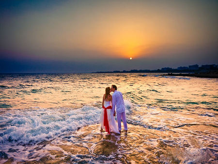 Beach stroll - woman, ocean, beach, sun, water, wedding dress, waves, kiss, romantic, man, beautiful, romance, ribbon, sand, sunrise