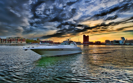 Leaving The City Behind - beauty, sky, peaceful, colorful, sunset, view, leaving, reflection, clouds, architecture, house, boat, ocean, houses, building, boats, sailing, buildings, lovely, nature, beautiful, splendor, city, colors, sea