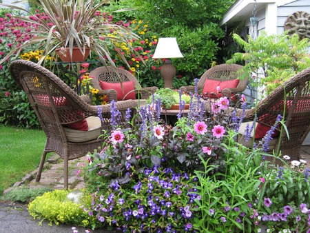 patio visit - cushions, table, chairs, patio, lamp, flowers, grass, wicker