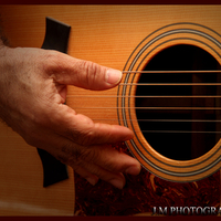 senior playing guitar