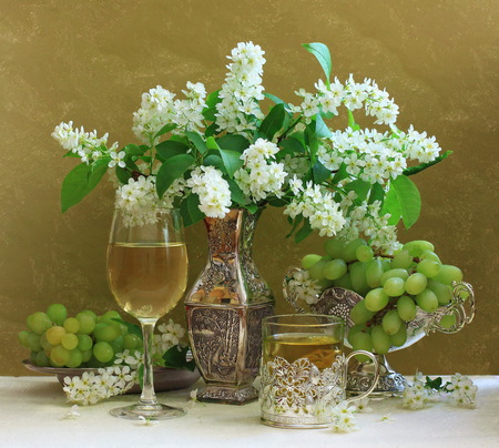 still life - nice, beauty, white wine, glasses, photography, bouquet, wine, still life, spring, white, silver, pretty, cool, green, harmony, fruits, tea, gentle, lovely, vase, beautiful, grapes, flowers, photo, drinks, twigs, flower, elegantly