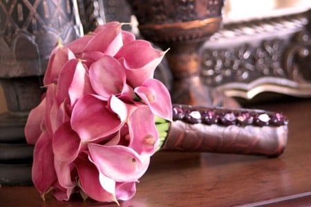 Calla lillies - pink, beautiful, flowers, bouquet, table, leather, lillies, calla lillies