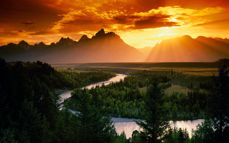 mountain high - clouds, water, landscape, filds, scenic, wet, beauty, grass, river, sunset, nature, green, land, mountains, sun, sky