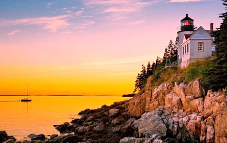 Yellow Sunset - sky, lighthouse, trees, cliff, sunset, plants, rocks, yellow, house, sea