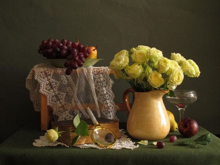 Yellow roses - table cloth, wine glass, stems, roses, plum, yellow, lace, green, glass, pear, magnifying glass, fruit, vase, beautiful, books, grapes, sweet