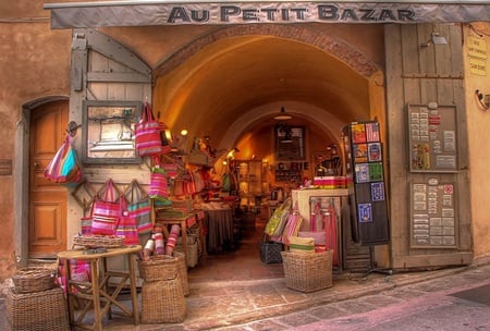 Au Petit bazaar - pretty, wicker, wood, brick, shopping bags, light, display cases, bazaar, door, trinkets, novely plates, baskets, goods, wall, shop