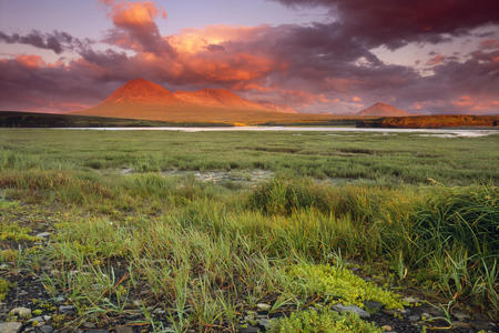 Spectacular sunrise over McNeil River and the Katmai Mountains - sunrise