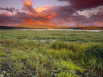 Spectacular sunrise over McNeil River and the Katmai Mountains