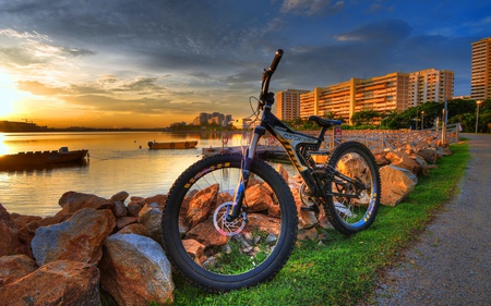 Beautiful Sunset - bike, colorful, sunset, road, view, lanterns, cool, reflection, golden, grass, boat, stone, building, mountain, boats, buildings, nature, pier, beautiful, sea, beauty, sky, golden sunset, trees, peaceful, water, rocks, pretty, clouds, architecture, green, hdr, house, tree, houses, ocean, summer, colored, bicycle, lovely, town, alley, splendor, city, colors