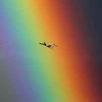 Bombardier CRJ 700 In Front of Rainbow