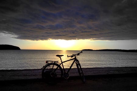 Just rest now... - silence, bike, shore, sky, sun, clouds, water, beaches, sea, beauty, ocean, rest, nature, tranquility, sunset, background, seascape