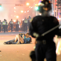 Kissing Couple During Chaos In Vancouver B.C. Riot  June 15th 2011 Following Game 7 of Stanley Cup Finals. (  Courtesy The Globe and Mail  )