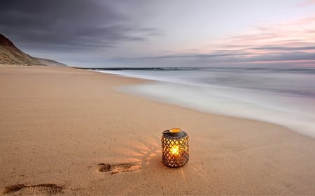 Simply Beautiful - paradise, sunset, view, lantern, evening, romance, lamp, candle, light, tropical, waves, nature, romantic, beautiful, hope, memories, sea, tropical beach, beauty, sky, beach, footprints, peaceful, candles, pretty, clouds, sand, ocean, lovely, exotic, traces, splendor, colors