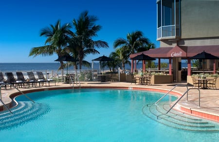 Amazing pool - blue water, view, amazing, beautiful, palmtrees, armchairs, spa, pool, sea, front