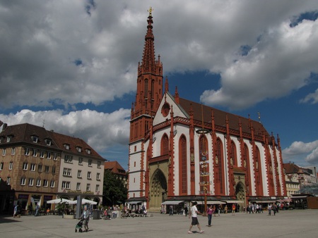 In the Center of Town - church, steppel, blue, tall, sky, town, architecture, religious, clouds, nature, day