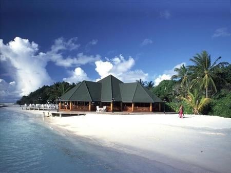 On the Beach - clouds, trees, water, person, blue, beach, ocean, sand, white, sky, building