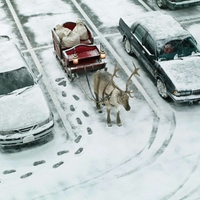 Santa in sleigh on street