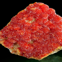 Fiery orange clusters of Orpiment on Barite covered matrix!