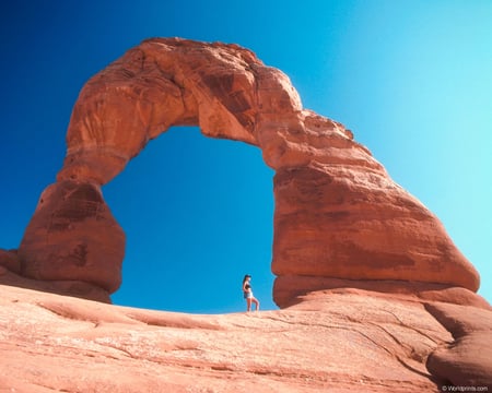 The Arch in Colorado - person, rock, arch, do, shadow, blue, sky, colorado, brown