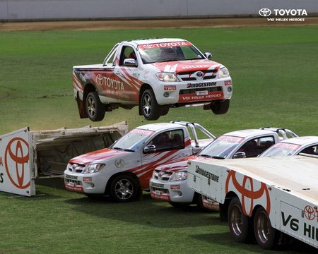 Jumping Toyota Truck - many, white, red, jump, truck, cars, trucks, grass