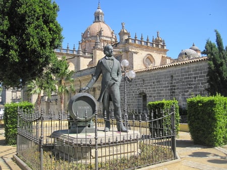 Church in Jerez de la Frontera Spain - monument, blue, fence, church, sherry, man, leaves, tree, spain, sky, statue