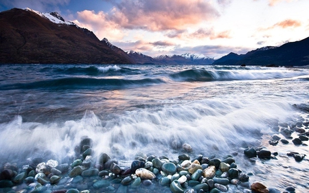 Wave Rolling In - rocks, water, beach, ocean, shore, sky, wave, clouds, mountain