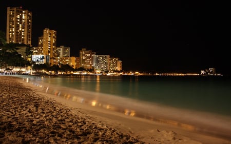 buildings on the beach - beach, ocean, coastline, water, night, shore, buildings, skyscrapers, dark, evening, reflection, sand, lights