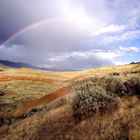 rainbow over hills 