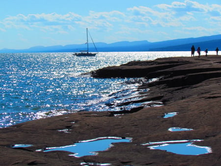 Late afternoon sailing - sky, sail, shoreline, water, sailing, shore, skyline, sailboat, boat