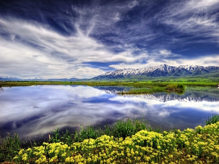 Landscape - pretty, yellow, splendor, landscape, grass, spring, yellow flowers, reflection, flowers, view, lake, sky, clouds, water, beautiful, beauty, colors, lovely, wildflowers, nature, green, mountains, peaceful